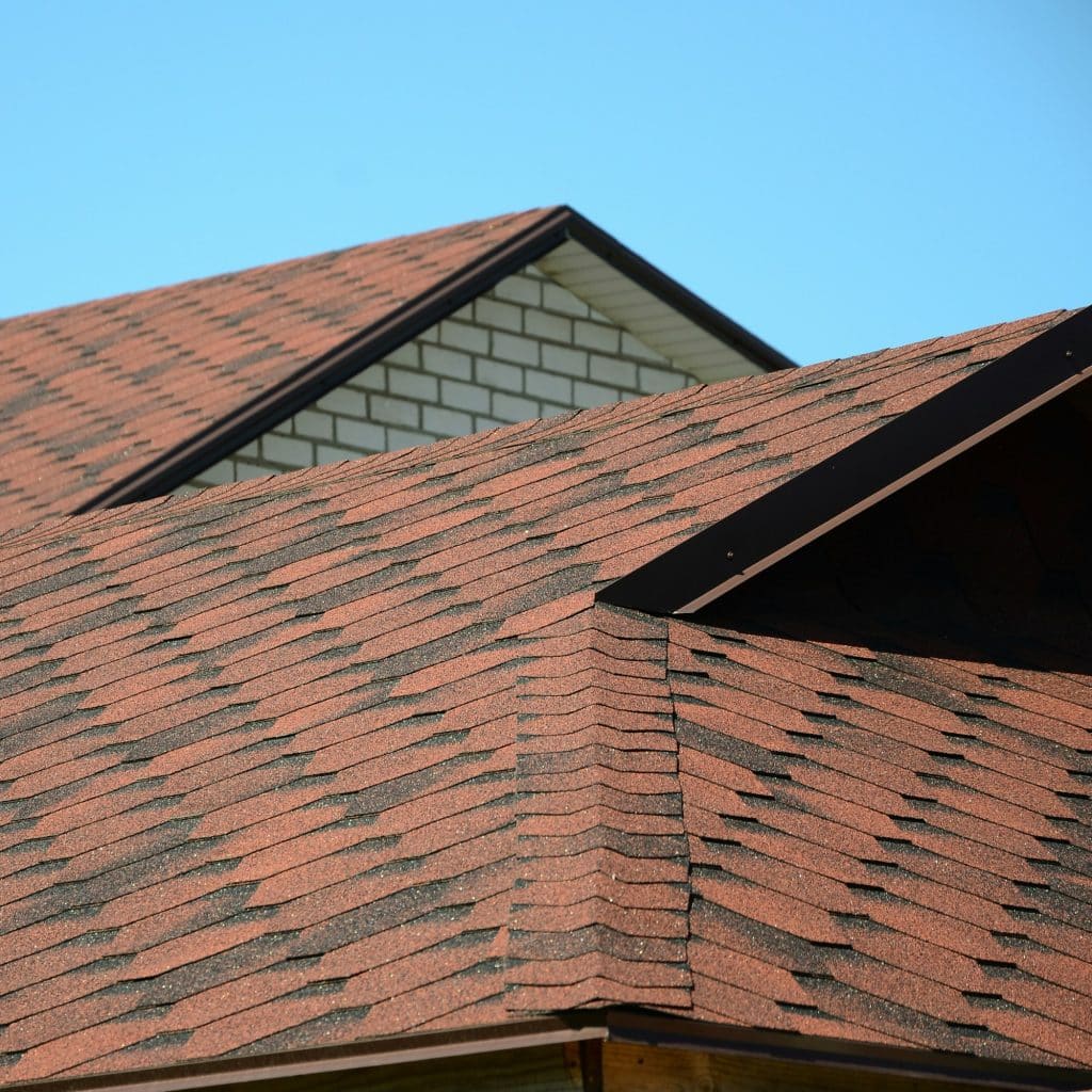 The roof is covered with bituminous shingles of brown color. Quality Roofing